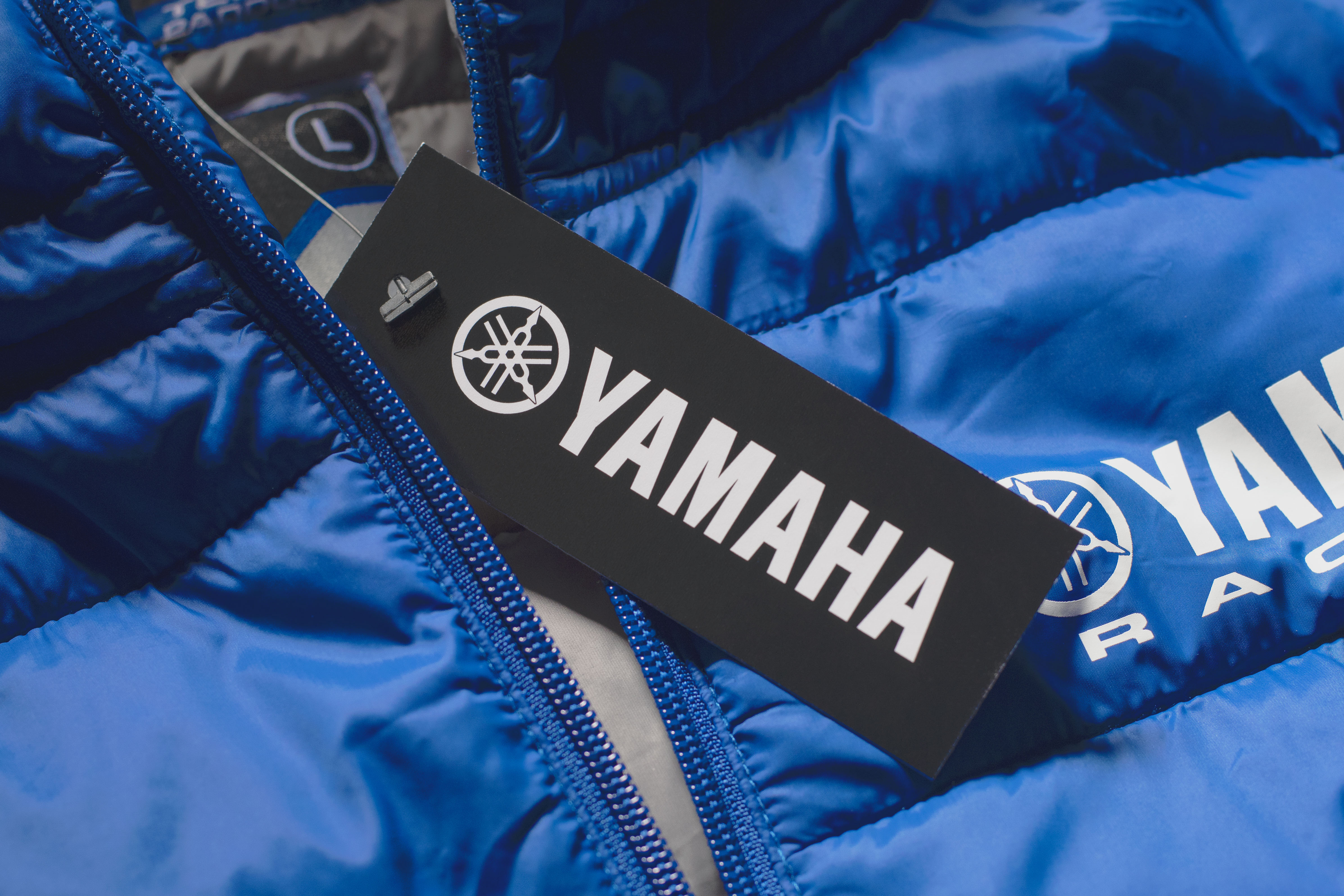 Close up of a hangtag on the Yamaha Puff Jacket